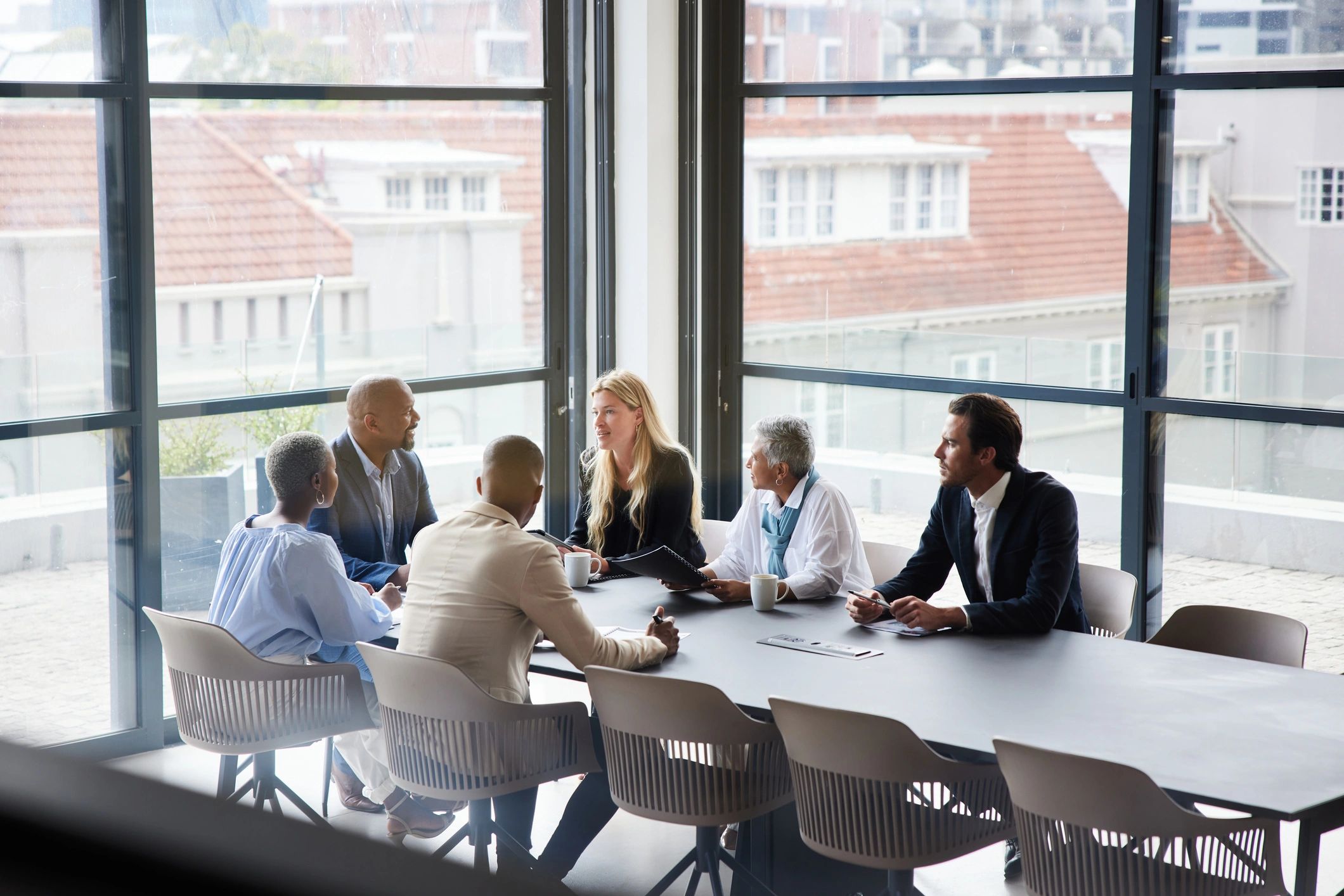 Businesspeople in a boardroom meeting discussing AI governance